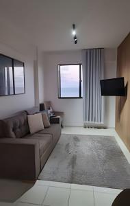 Χώρος καθιστικού στο Lindo Apartamento Vista para o Mar. (2 quartos)