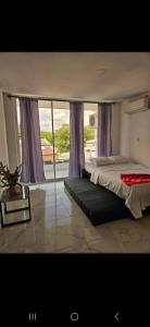 Postel nebo postele na pokoji v ubytování Nº 302 Aparta vacacional Doradal