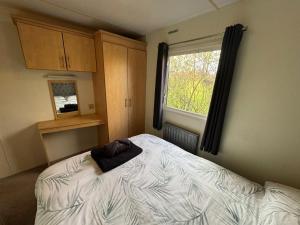 En eller flere senge i et værelse på The Lodge at Woodland Forge