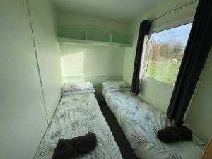 En eller flere senge i et værelse på The Lodge at Woodland Forge