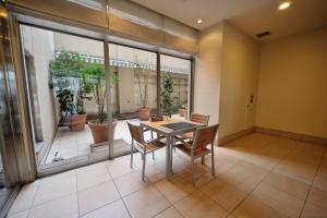 a dining room with a table and chairs at Dormy Inn Express Koriyama in Koriyama