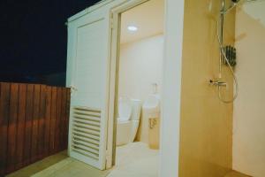 a bathroom with a toilet and a shower at Mary's Villas Private Pool In Noord in Noord +59 photos