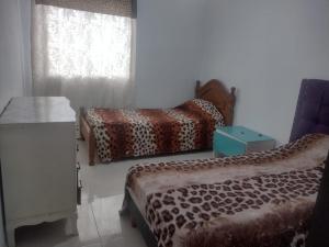 a room with two beds and a window at Mendoza in Barraquero