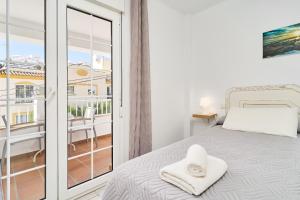 Ένα ή περισσότερα κρεβάτια σε δωμάτιο στο Apto 8 Almoraide Suites +20 φωτογραφίες