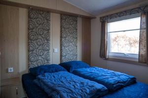 En eller flere senge i et værelse på Camping de Zandput - 237