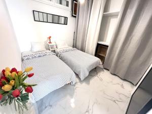 Ένα ή περισσότερα κρεβάτια σε δωμάτιο στο Limitrophe Monaco