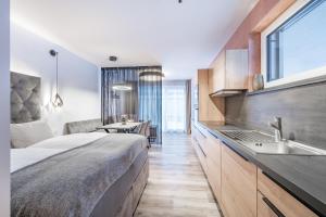 a hotel room with a large bed and a sink at MYALPS Jordans Lodge in Längenfeld