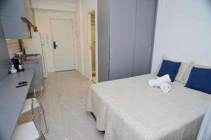 Postel nebo postele na pokoji v ubytování Gray One - Apto com varanda, poucos passos da estação Luz + 74 fotografií