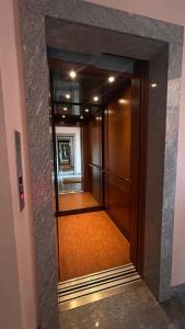 a view of a hallway in a building at Alida in Salò +6 photos