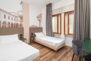 Postel nebo postele na pokoji v ubytování B&B HOTEL Treviso Al Fogher