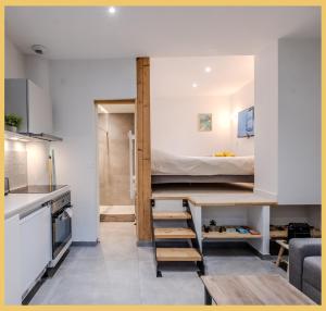 a small apartment with a bunk bed in a room at L'Ecrin du Lac I Studio I Sévrier in Sévrier +17 photos