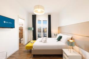 Ένα ή περισσότερα κρεβάτια σε δωμάτιο στο Mapi’s Rooms