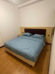 Giường trong phòng chung tại 51 Home Imperial Suites Apartments