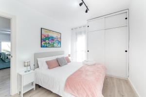 Ένα ή περισσότερα κρεβάτια σε δωμάτιο στο Encalma Vacacional siente disfruta vive la playa +39 φωτογραφίες