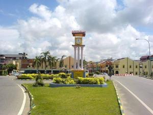 a clock tower in the middle of a street at Azizan Homestay Bahau in Bahau