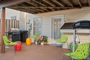 a patio with chairs and a grill on a house at Fireplace • Grill • Gym‑Ready • Near Bull Run in Centreville