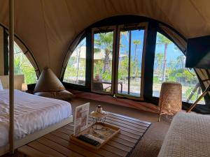 Una cama o camas en una habitación de Camp Cayla - COASTA