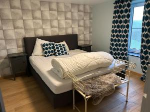 Ένα ή περισσότερα κρεβάτια σε δωμάτιο στο Maprérie