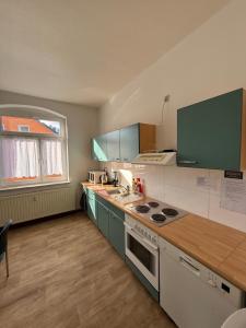 Nhà bếp/bếp nhỏ tại Ferienwohnung Goldener Drache +11 ảnh