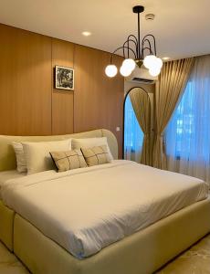 Postel nebo postele na pokoji v ubytování The Five Ikoyi