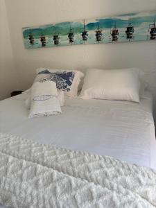 Ένα ή περισσότερα κρεβάτια σε δωμάτιο στο Almas gêmeas suíte 6