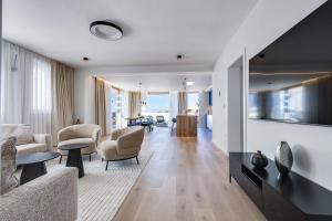 a living room with a couch and chairs at Villa Mare Zadar in Zadar