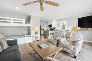 a living room with a couch and a table at One Bedroom at Beachwood Villas on 30a in Seagrove, Florida in Santa Rosa Beach +57 photos