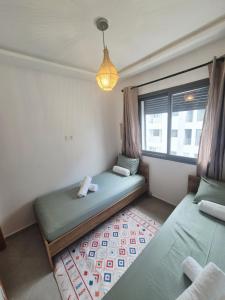 Ένα ή περισσότερα κρεβάτια σε δωμάτιο στο Glorious appartement cosy