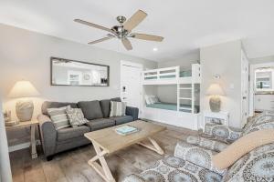 a living room with a couch and a table at One Bedroom at Beachwood Villas on 30a in Seagrove, Florida in Santa Rosa Beach