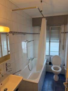a bathroom with a tub and a toilet and a sink at 3 bedrooms apartment in Fionnay in Fionnay