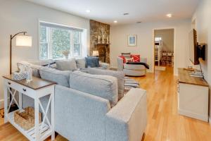 a living room with a couch and a table at 8 Mi to Dtwn Saratoga Springs Quiet Family Home in Gansevoort