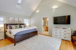 a bedroom with a large bed and a television at 8 Mi to Dtwn Saratoga Springs Quiet Family Home in Gansevoort