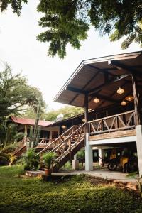 a building with a wooden staircase in front of it at The Sanctuary Wellness Resort in Escameca