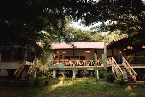 a house with a staircase leading to it at The Sanctuary Wellness Resort in Escameca