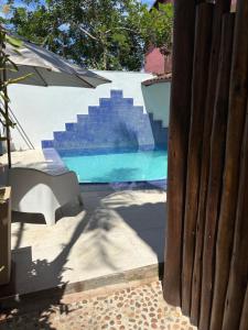 Бассейн в Almas gêmeas suíte 6 или поблизости