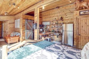 a bedroom with a bed in a wooden cabin at Walk to Main Street! Mtn-View Getaway in Pioche in Pioche