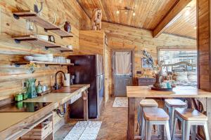 a kitchen with wooden walls and wooden counters at Walk to Main Street! Mtn-View Getaway in Pioche in Pioche +16 photos
