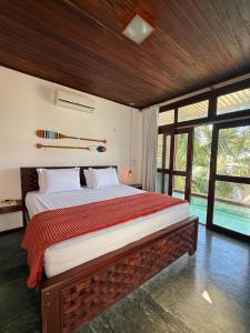 En eller flere senge i et værelse på Grand VillaBlue pousada boutique