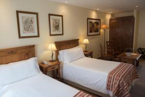 Ένα ή περισσότερα κρεβάτια σε δωμάτιο στο Hostal del Bosque