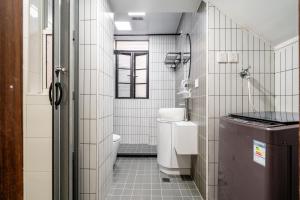 a small bathroom with a toilet and a sink at Changle Road in Shanghai