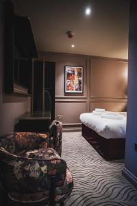 Кровать или кровати в номере The Kensington Hideaway