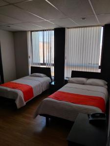 Postel nebo postele na pokoji v ubytování Hotel Bariloche Premium