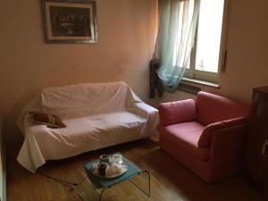 a living room with a couch and a table at B&B san Biagio parma in Parma
