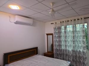 Postel nebo postele na pokoji v ubytování Pipuni villa