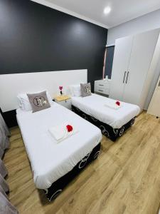 Ένα ή περισσότερα κρεβάτια σε δωμάτιο στο PPi LODGE