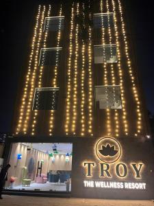 a building with lights on the front of it at Troy Resorts and wellness in Zirakpur