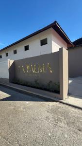 a building with a sign that reads iranivantini center at La Palma Experience in Panama City