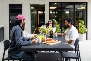 a group of people sitting around a table at Outsite Mexico City Roma Sur - Work, Connect, Explore in Mexico City +21 photos