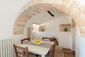 Et opholdsområde på Trullo Suite Tulipano ad Alberobello