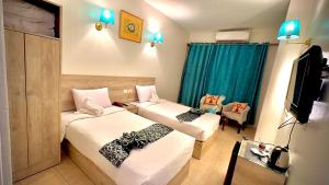 Postel nebo postele na pokoji v ubytování Nile Hotel